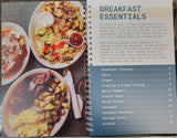 cookbook interior pages featuring a table of contents for breakfast recipes, as well as a picture of a variety of dishes.