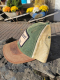 Brown and green cap with a Hells Canyon Oregon beige patch.