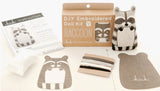 D.I.Y. Embroidered Doll Kit with raccoon design on a white background.