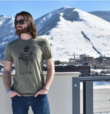 Man wearing a olive green t-shirt with a Smokey Bear graphic design.