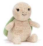 Green and beige plush toy.