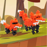 Two  ox figures made of interlocking bricks on a forest background.