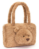 Fluffy brown handbag with a teddy bear face.