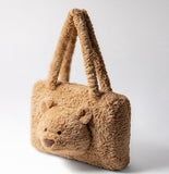 Brown teddy bear-shaped handbag.