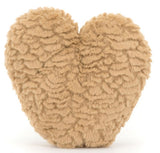 Heart-shaped beige plush toy.
