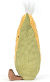 Yellow plush corn toy with green plush husk and white silk and brown legs.