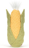 Yellow plush corn toy with green plush husk and white silk.