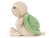 Green and beige plush toy.