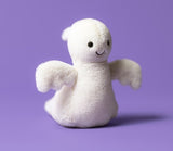 White plush ghost toy with a smiling face.