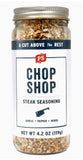 Clear jar of Chop Shop steak seasoning with visible contents and a white label.
