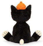 Black and white plush toy cat with an orange cap and smiling expression.