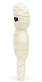 Plush white mummy toy with black eyes and a smiling face.