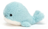 Plush toy whale with a light blue body, white belly, and a smiling face.