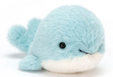 Plush toy whale with a light blue body, white belly, and a smiling face.
