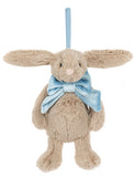 Plush beige bunny wearing a large light blue bowtie, suspended by a light blue ribbon ornament hanger.