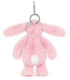 Pink plush bunny keychain on a white background.