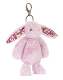 Pink bunny plush keychain with floral ears on a white background.