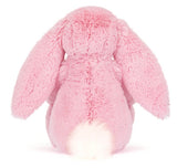 Pink plush bunny toy on a white background,