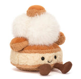 Beige and brown plush cake toy with white fluffy top.