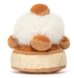 Beige and brown plush cake toy with white fluffy top.