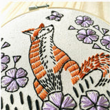 Embroidery hoop with a fox and floral design.