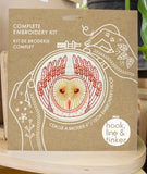 Embroidery kit packaging with owl design and 'hook, line & tinker' branding.