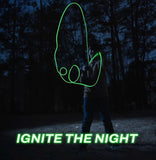 The zipstring luma in use, projecting glowing string outward away from the user, at night. Text reads "Ignite the night."