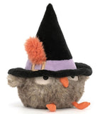 Gray plush toy owl wearing a large black witch hat with an orange feather tucked into the purple hatband.