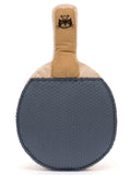 Plush toy table tennis racquet with one gray side and one red side. It has a smiling face and little legs.