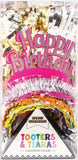 Packaged birthday tooters and tiaras with colorful tassels and 'Happy Birthday' text.