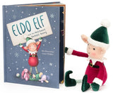 Children's book titled 'Eldo Elf' with a plush elf toy on a white background