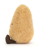 A plush toy resembling a potato with a smiling face, made from golden-brown fur fabric with corduroy legs.