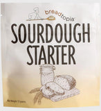 Breadtopia Sourdough Starter package with illustrations of bread and a jar on a gradient background.