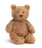A brown plush bear, sitting upright.