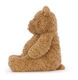 A brown plush bear, sitting upright.