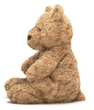 A large brown plush toy bear with a soft, fluffy texture in a sitting position.