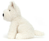 A plush toy Scottie dog with a fluffy fur.