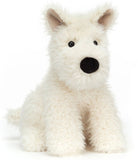 A plush toy Scottie dog with a fluffy fur.