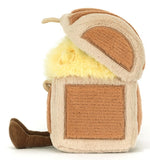 Plush toy resembling a brown and beige treasure chest with brown legs.