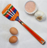 Colorful spatula with eggs, salt, and garlic.