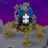 Lunar lander toy figure in gold, gray, blue and white.