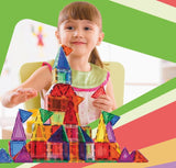 Child playing with colorful magnetic building blocks 